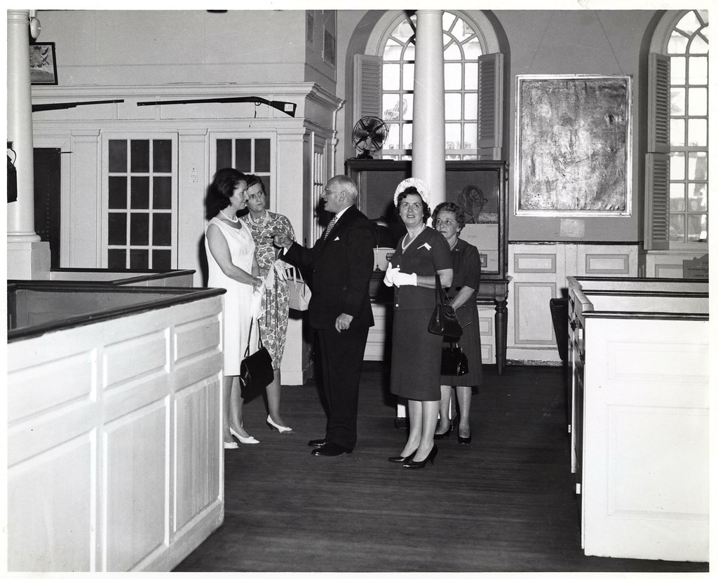 Two unidentified women; Mark Bortman, Chairman of the Civic Committee of the People-to-People Program; Mary Collins; and Llora Bortman inside the Old South Meeting House